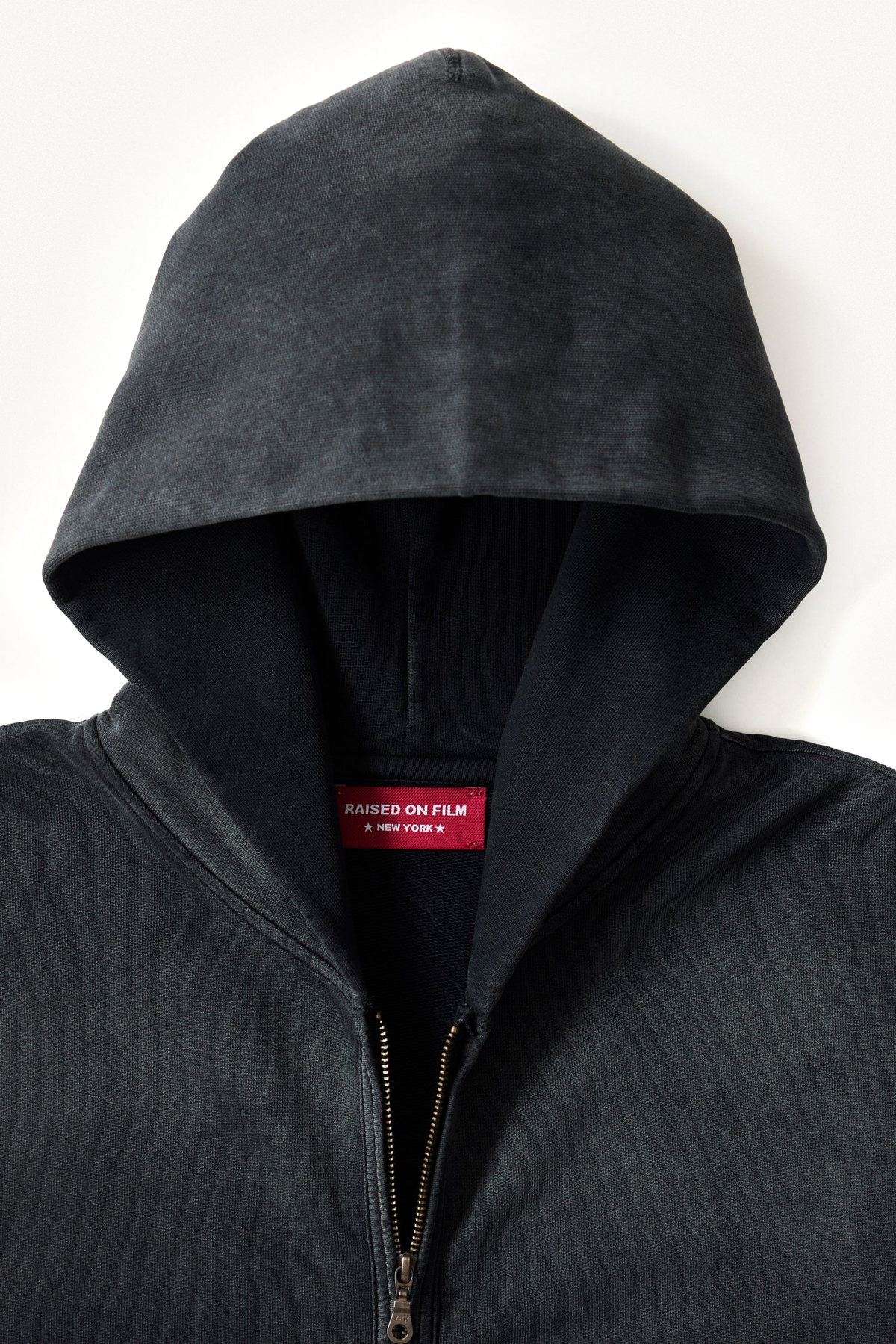 Zip Hoodie in Black, hood, zipper and red label detail