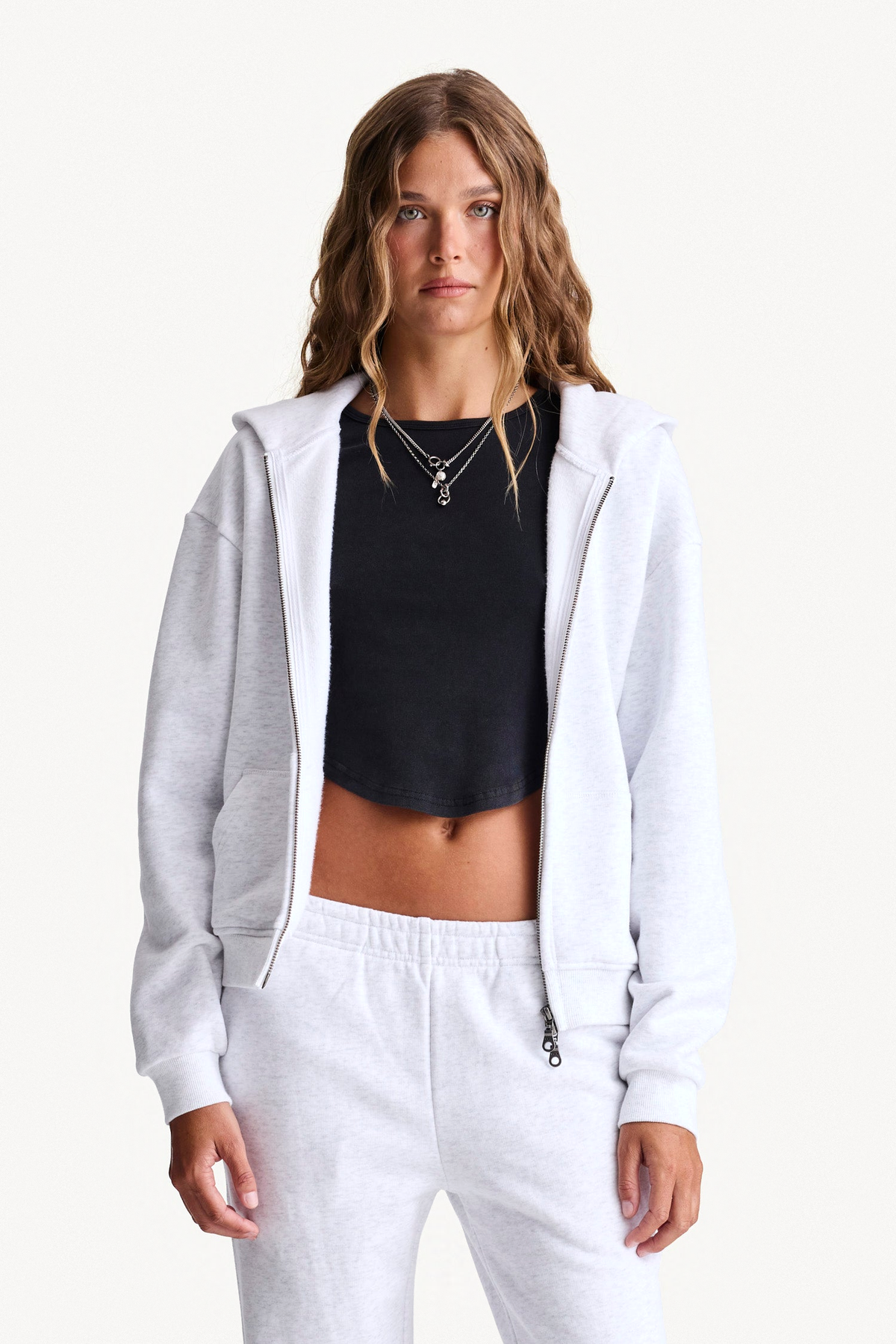 Grey Zip Hoodie worn open, showing the French terry shape and ribbed cuffs