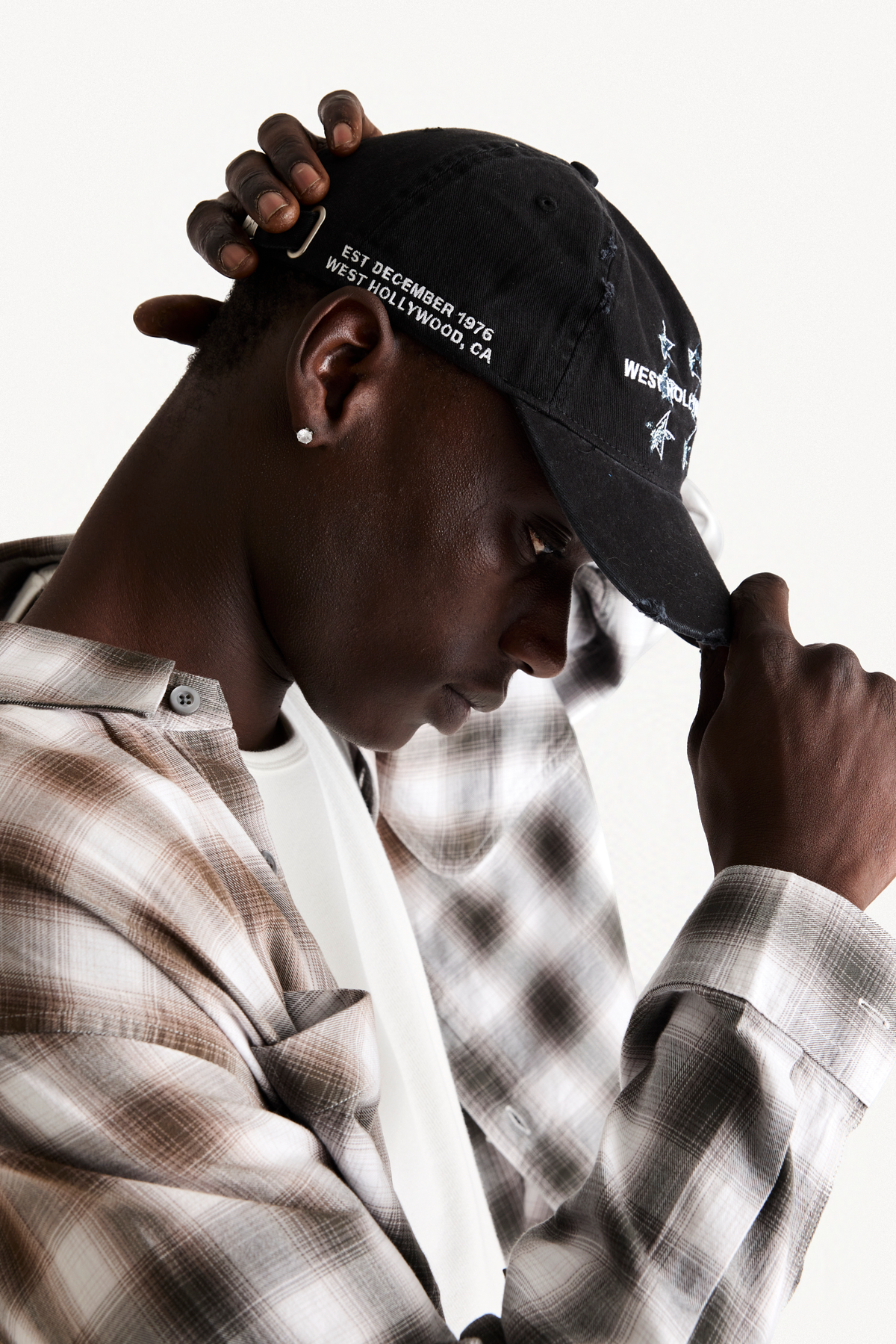 Hollywood Cap - Black, on-body view, hand on cap