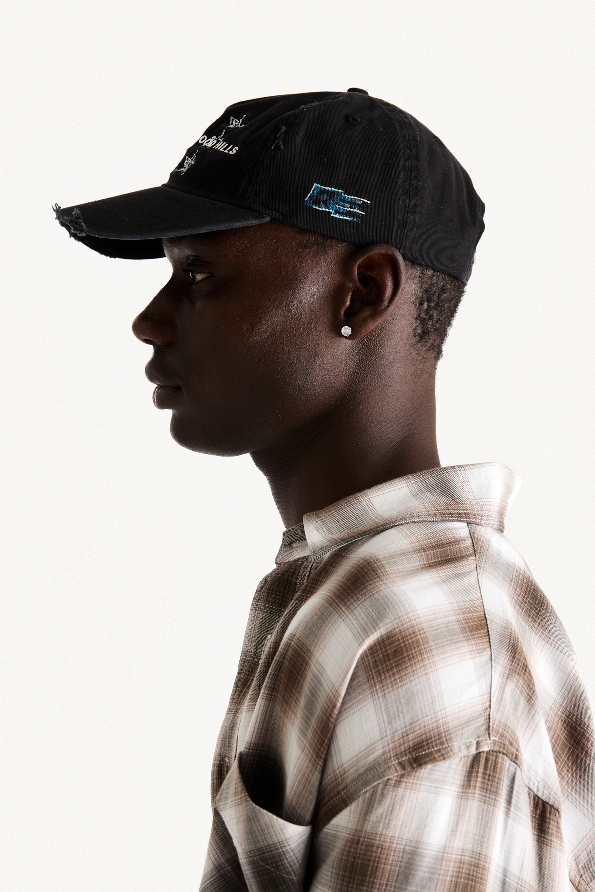 Hollywood Cap - Black, on-body profile view
